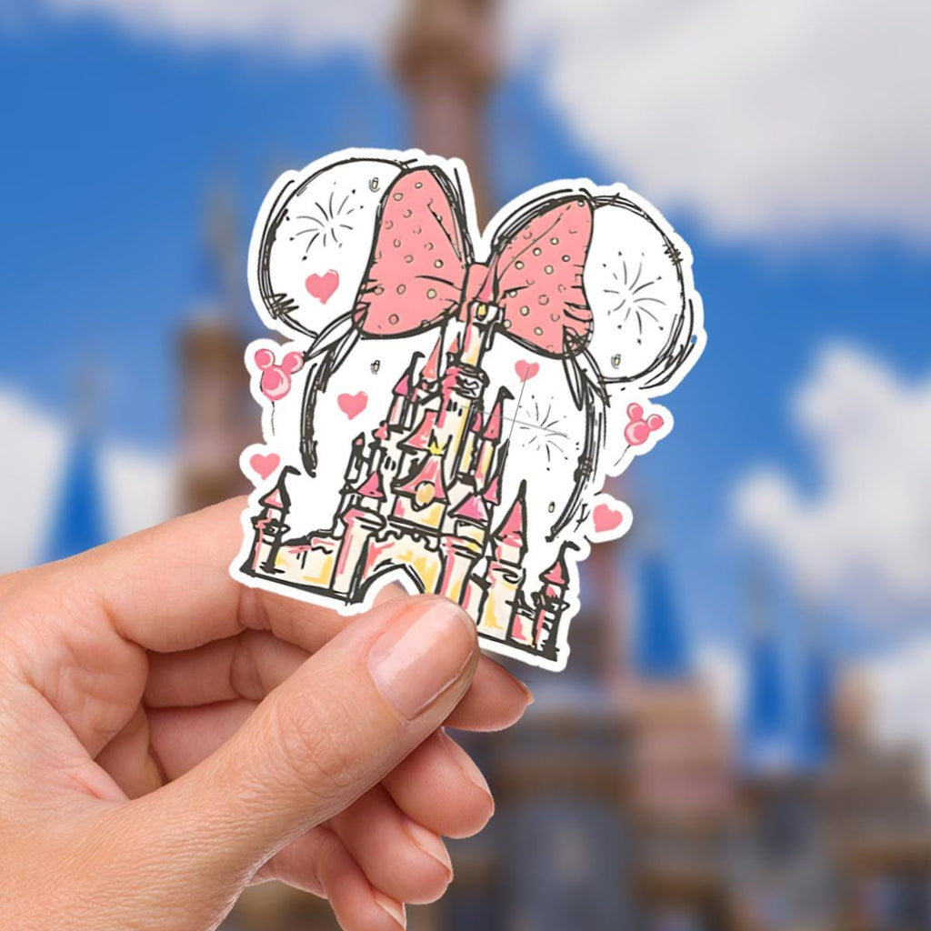 Disney Minnie Mouse Castle Waterproof Disney Laptop Stickers/  Mickey, Minnie, Stitch planner stationery decal water bottle cell phone.  A sticker featuring a pink bow, Mickey Mouse ears, and a castle. The bow has polka dots, and the castle is pink and yellow. Hearts and fireworks are scattered around the ears. The design is a whimsical Disney theme.