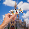 A colorful sticker featuring Disney characters. The sticker showcases Daisy Duck in a purple dress, Pluto, Donald Duck, Mickey Mouse, Minnie Mouse, and Goofy. They are all smiling and standing together. Hydro bottle, water bottle, journal decal