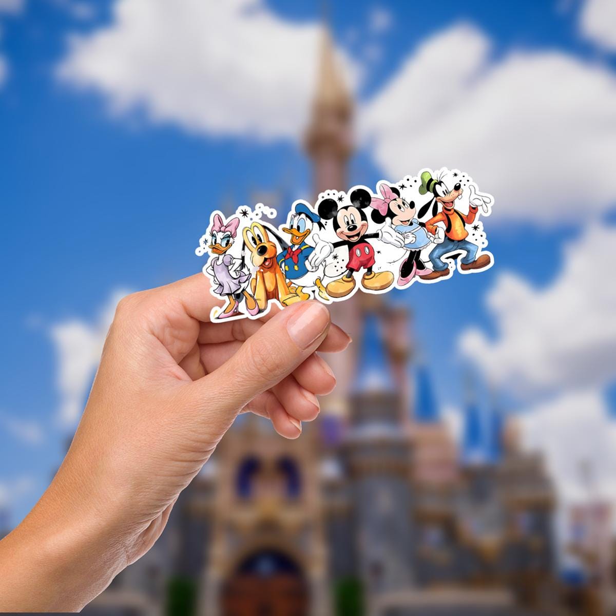 A colorful sticker featuring Disney characters. The sticker showcases Daisy Duck in a purple dress, Pluto, Donald Duck, Mickey Mouse, Minnie Mouse, and Goofy. They are all smiling and standing together. Hydro bottle, water bottle, journal decal