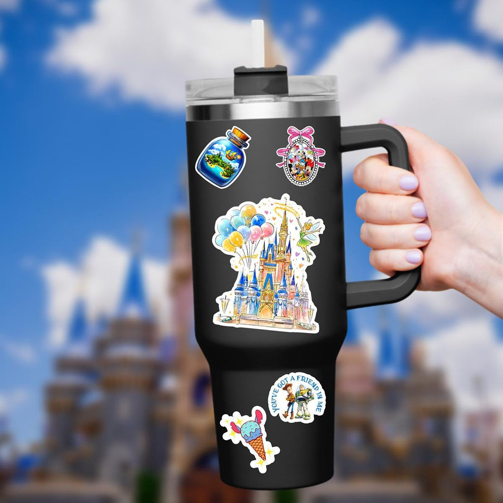 Disney World Castle Balloons TinkerBelle Laptop Sticker/ Magic Kingdom Fantasyland Disney decal/ planner water bottle cell phone decal A colorful Disney castle sticker held in a hand. The castle is painted with shades of blue, pink, and gold, featuring multiple turrets and a detailed facade. A fairy with green attire and wings hovers nearby, waving a wand. A cluster of balloons in yellow, blue, and pink floats above the castle.