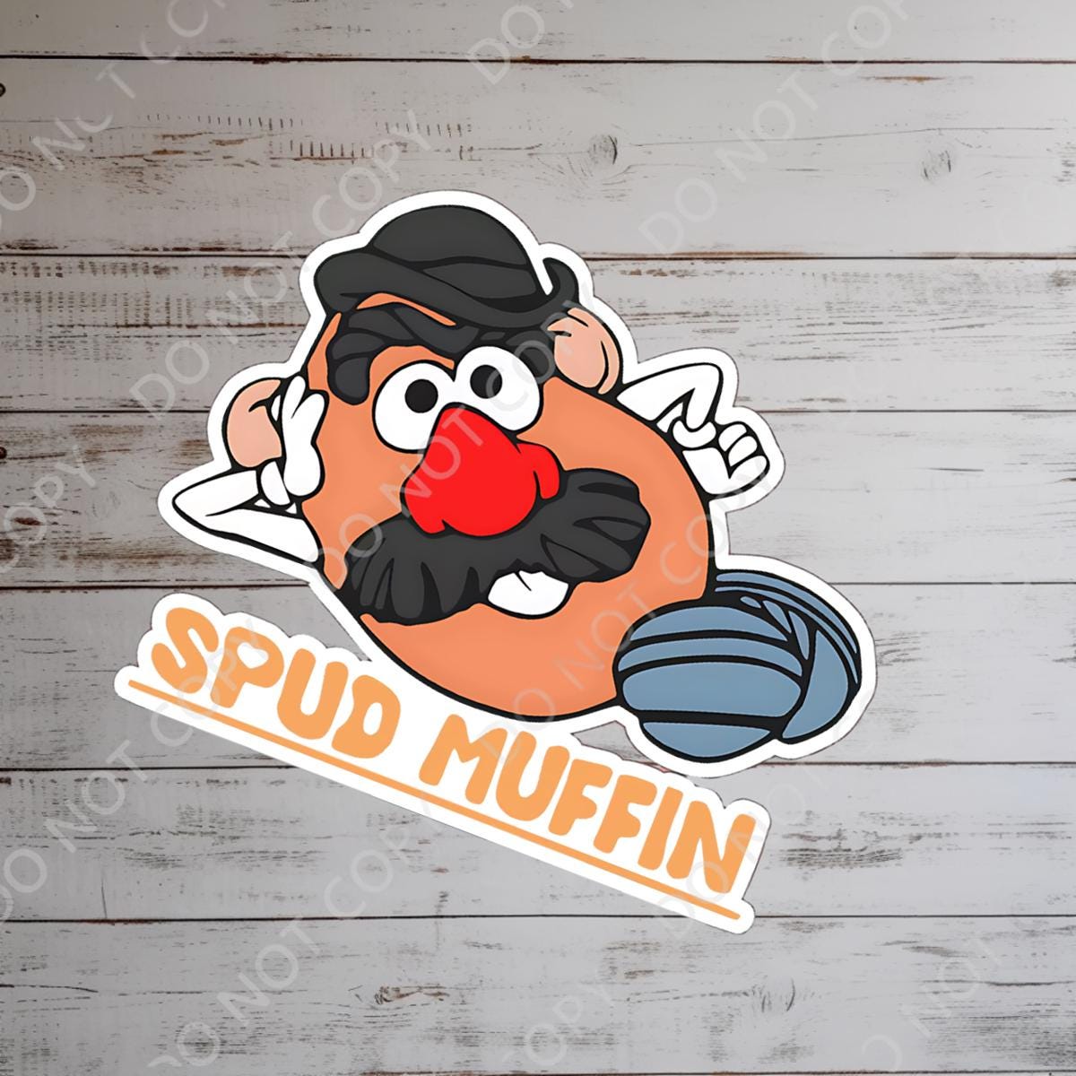 A Disney sticker featuring a cartoon character with a potato-shaped head, a black hat, mustache, and a red nose. The sticker has the text "SPUD MUFFIN" in orange letters.