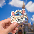 Lilo & Stitch Humor Sticker: Waterproof Vinyl Decal Hydroflask Journal .  A blue Stitch sticker adult humor with red sunglasses and a newspaper. The sticker has the phrase 'silently judging' in a red, star-framed font. The background shows a blurred image of a blue sky and disney castle. Hydro bottle sticker, weather proof.